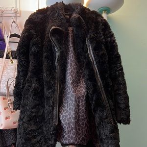 Woman black faux fur coat.